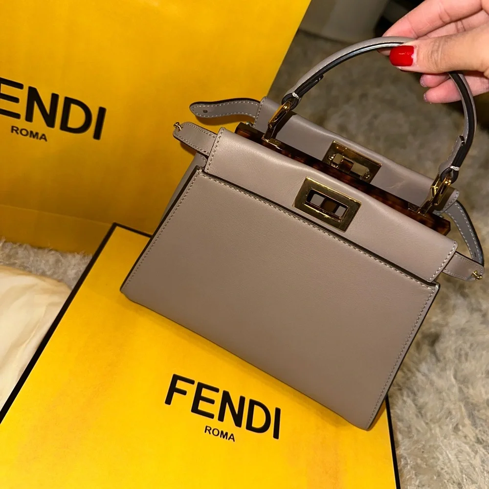 fendi peekaboo mini box dust bag rain coat Fabric Jacquard FF 1974 Woven Knotted Iconic Satchel Tobacco Moro 1677144 Iconic small Peekaboo bag made of dove grey leather and embellished with the classic twist lock on both sides When you need a raincoat